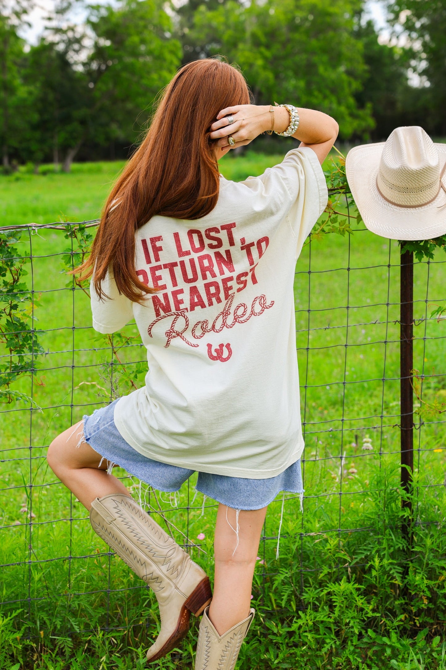 IF LOST RETURN TO THE NEAREST RODEO TEE