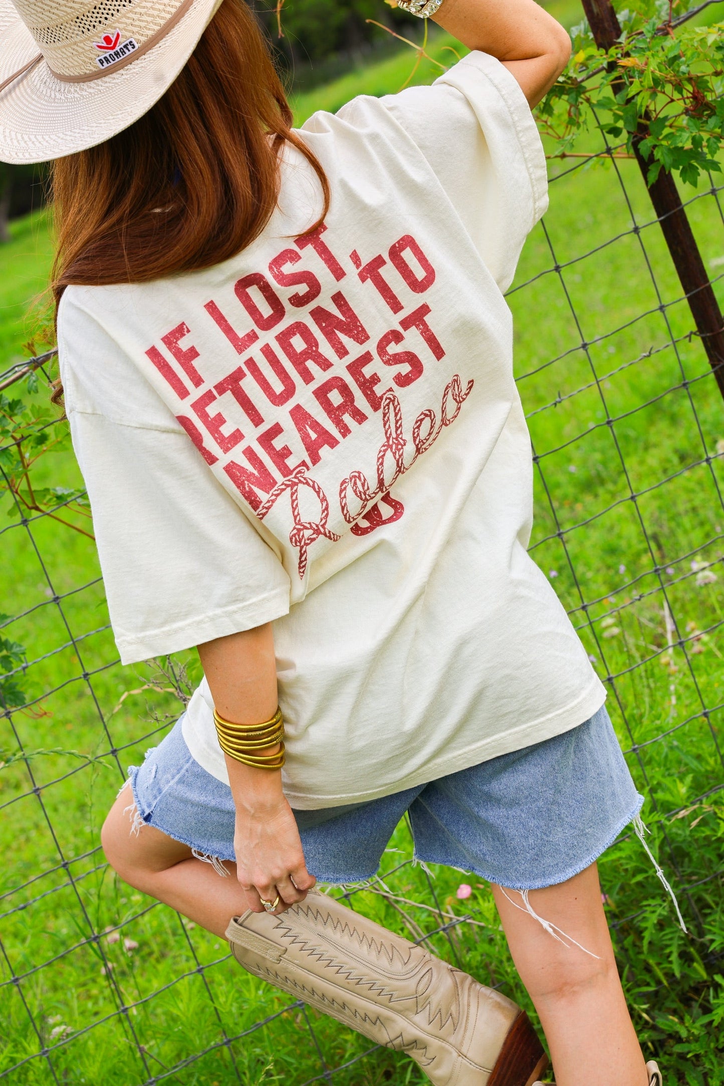 IF LOST RETURN TO THE NEAREST RODEO TEE